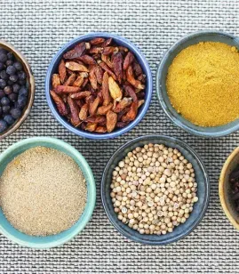 Bowls of colourful spices and seeds